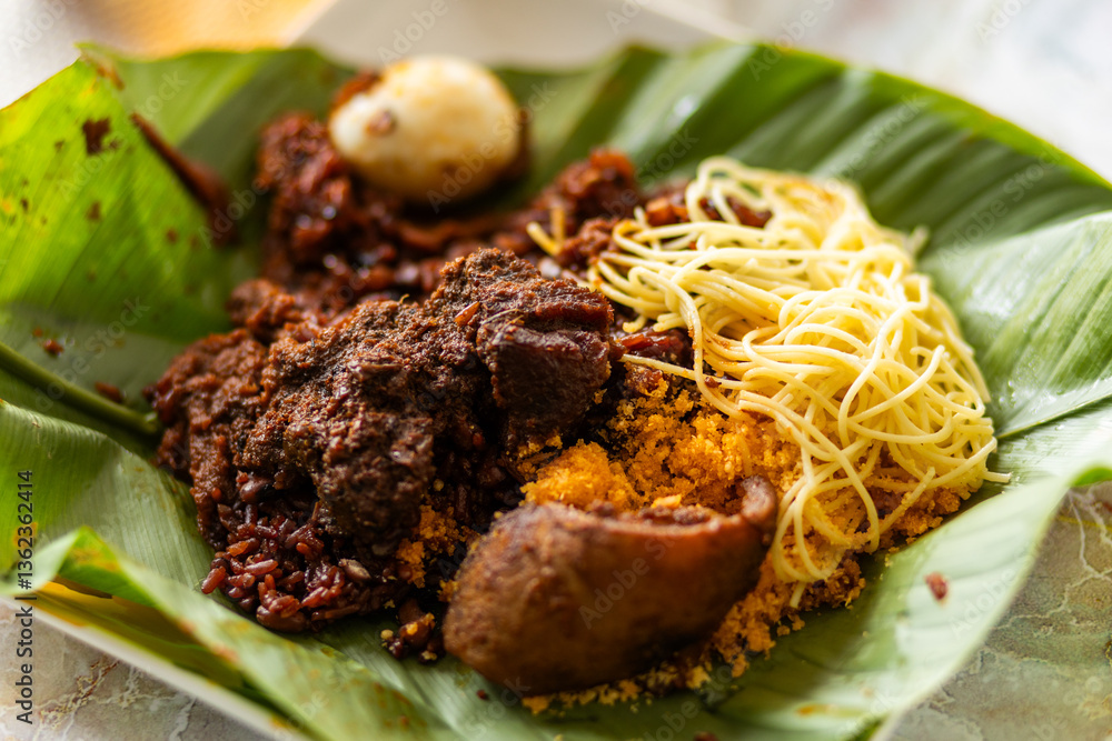 Waakye with spaghetti, gari and stew